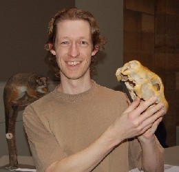 Chris Rehberg holding skull of Thylacoleo carnifex